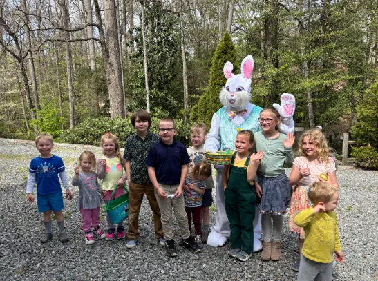Children line up with the Easter Bunny for a group photo.